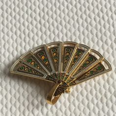 Vintage Articulated Fan Pin Brooch. Made in Spain. Metal Brass and Hand Painted Miniature Fan Pin Brooch. Charming for Pendant or Pin. This opening and closing fan brooch is in good shape. A charming little miniature. Size: Fan Open: 2 5/16" X 1 11/16" Tall For other handmade and vintage items see:  www.VeryVictorianStudio.etsy.com. For sewing related items see my other shop: www.SewingRoomStore.etsy.com.  Thank you for looking! Fan Jewelry, Pin Brooch, Collectable Items, Pendant Necklaces, Brooch Pin, Brooches, Jewelry Necklace Pendant, Vintage Jewelry, Vintage Items