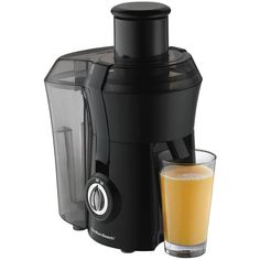 an image of a juicer with a glass next to it