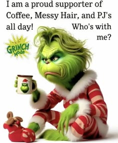 the grinch is holding a coffee mug