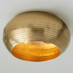 a light that is hanging from the ceiling with a circular design on it's side