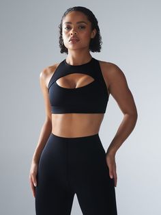 Hotline Medium-Impact Sports Bra in Black | SAVAGE X FENTY Sports Activewear With Built-in Padding And T-back, Sporty Fitted T-back Sports Bra, Fitted Nylon Activewear For Sports Events, Breathable T-back Athleisure Activewear, Functional Medium Support T-back Activewear, Compressive Nylon Sports Bra For Sports Events, High Stretch T-back Activewear, Sporty T-back Activewear With 4-way Stretch, Nylon Racerback Activewear For Gym