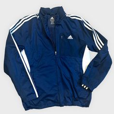 Brand: Adidas Rn # 88387 Size: Unisex Small ( S ) Color: Navy With White Stripes And Accents Zip Closure With 3 Pockets Inside Is A Mesh Material. Outside Is 100% Polyester. Machine Washable And Dryer Safe. Adidas Long Sleeve Windbreaker With Three Stripes, Blue Adidas Windbreaker For Spring, Adidas Blue Windbreaker For Spring, Adidas Blue Spring Windbreaker, Adidas Navy Sports Outerwear, Navy Adidas Sports Outerwear, Navy Adidas Outerwear For Sports, Adidas Zip Up Hoodie, Adidas Zip Up