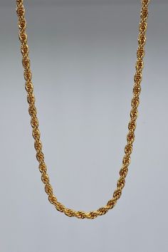 An intricate industrial styled rope chain is elegantly cast in 18 karat gold fill. Dressed up or down, the chain texture and detail is just beautiful, and it will easily become your go-to favorite. 18k Gold Fill Chain Length is 18" Chain Links are 2mm Handcrafted in the USA Ships from the USA Why we love this product? Simply stunning, the rich gold color sparkles, and the necklace when held is lightweight and balanced. The craftsmanship is stunning and the intricate design can be worn with anyth Gold Rope Chain Necklace As A Gift, Gold Plated Rope Chain Necklace As Gift, Classic Gold Rope Chain Necklace With Adjustable Chain, Classic Gold Rope Chain Necklace With Wheat Detail, Gold Classic Figaro Rope Chain Necklace, Classic Gold Rope Chain Necklace With Figaro Detail, Gold Link Rope Chain Necklace, Gold Necklaces With Rope Chain And Link Shape, Gold Figaro Rope Chain Necklace