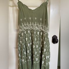 This Dress Is The Perfect Sun Dress For Your Summer And Spring Wardrobe. With Adjustable Spaghetti Straps And White Floral Embroidery, This Is An Easy Dress For A Wedding, Brunch, Or Garden Party. Casual Green Embroidered Summer Dress, Green Casual Embroidered Summer Dress, Embroidered Cotton Dress With Spaghetti Straps, Embroidered Sundress With Spaghetti Straps, Vacation Sundress With Floral Embroidery And Spaghetti Straps, Casual Green Dresses With Embroidered Hem, Garment Bags, White Embroidery, Spring Wardrobe