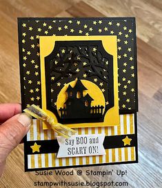 someone is holding up a card that says say boo and scary on it with stars