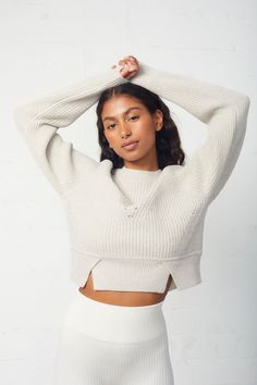 The Izzy Crewneck Sweater is a stylish sweater featuring cut-outs on the shoulders, combined with short-row fashioning for a modern and sophisticated look. The crewneck design is comfortable and suited to any occasion. 100% Wool Model is 5'7" and wearing a size small Chic Cropped Crew Neck Sweater, Chic Sweater With Ribbed Cuffs And Stretch, Chic Stretch Sweater With Ribbed Cuffs, Chic Cropped Sweater With Crew Neck In Pointelle Knit, Chic Cropped Sweater With Pointelle Knit And Crew Neck, Chic Cropped Sweater With Pointelle Knit, Chic Crew Neck Sweater With Ribbed Neckline, Stretch Cropped Sweater With Ribbed Crew Neck, Chic Cropped Crew Neck Sweater For Layering