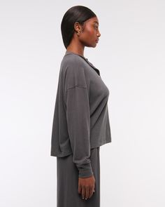 Slim-fitting long-sleeve henley top in our soft cozy lounge fabric and oversized-fit silhouette, featuring a button-up neckline and all-over textured detail. Everyday Comfy Long Sleeve Tops, Comfy Long Sleeve Tops For Everyday, Relaxed Fit Cozy Long Sleeve Top For Layering, Relaxed Long Sleeve Tops With Soft Texture, Cozy Long Sleeve Loungewear Top For Winter, Cozy Long Sleeve Top For Winter Loungewear, Relaxed Long Sleeve Tops For Loungewear, Comfy Long Sleeve Tops With Soft Texture, Henley Loungewear For Fall