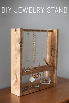 the diy jewelry stand is made out of wood