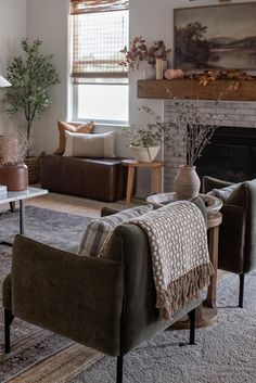 a living room filled with furniture and a fire place