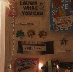 there are many magnets on the wall with pictures and lights around them that say laugh laugh laugh laugh laugh laugh laugh laugh