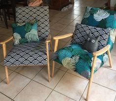 two chairs sitting on top of a tiled floor