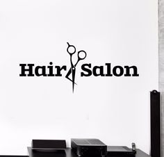 a hair salon wall decal with scissors on it