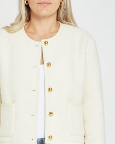 Price Comparison Few Moda $89 Veronica Beard $748 Reformation $298 Product Details Introducing the Joe Cropped Jacket, a sophisticated and chic piece of outerwear. Made of cream tweed and detailed with gold buttons, this elegant design offers a timeless, cropped silhouette for a graceful look. - Relaxed fit- Buttons- Pockets- Content: Fabric: 60% Wool, 40% Polyester | Lining: 100% Polyester Style# C23WOU50117G Fit Notes - Designed to have a relaxed fit throughout - Model wearing a size S - Model Chic Cream Cropped Jacket With Pockets, Beige Collared Classic Cropped Jacket, Beige Cropped Jacket With Button Closure, Luxury Cream Long Sleeve Cropped Jacket, White Cropped Jacket With Button Closure, Beard Colour, Cami Bodysuit, The Joe, Price Comparison