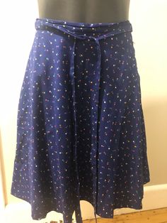 For sale is a vintage blue floral skirt from the 70s or 80s. Tag reads 100% Baumwolle, which is cotton in German. Tag says 38 but I think it is more a Eur 34-36 so an Aus/UK size 8 or US size 4-6. Please check the actual measurements below. Skirt is lined with side zip and ties at waist. Colours are vibrant, skirt is lined. Excellent condition. Measurements: Across waist - 35cm/ 13 3/4 inches Length - 52 cm/ 20 1/2 inches Cotton A-line Skirt With Floral Print, Blue A-line Cotton Bottoms, Retro Cotton Skirt For Spring, Vintage Cotton Dresses With Lined Skirt, Retro Blue Cotton Skirt, Retro Blue Lined Skirt, Blue A-line Cotton Skirt, Retro Blue Midi Skirt, Blue Lined Vintage Skirt