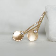 "Tiny diamond and 14k gold petal dangle earrings. Each petal is handmade by melting 14k or 18k gold into a ball, and hammering and shaping it into a unique little buttercup petal shape. Because of the way I cupped the petals, they reflect light and glow like little buttercups in the sun. Polished to a brushed satin finish. These dainty little earrings are the perfect choice for every day, and can be dressed up or down for any occasion. Simple, elegant, comfortable and just so sweet. Petals - abo Nice Earrings, Petal Earrings, Lake Oswego, Gold Nugget, Tiny Diamond, Diamond Gold, Metal Clay, Gold Earrings Dangle, Recycled Gold