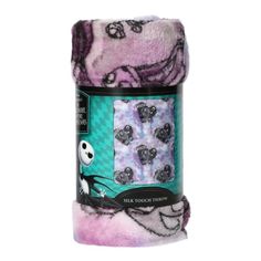 a roll of purple and black towels on top of each other, with the image of jack