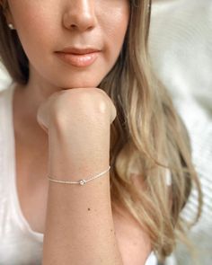 Both elegant and timeless, this bracelet features a scintillating bezel-set diamond on a delicate cable chain. #BrilliantEarth #silverbracelet #diamondbracelet #delicatebracelet #daintybracelet #simplejewelry #classic #conflictfree Elegant Diamond Bracelet With Cable Chain, Minimalist Diamond White Sterling Silver Bracelet, Dainty Bezel Set Chain Bracelet, Adjustable Diamond Bracelet With Delicate Chain, Timeless Adjustable Bracelet With Single Diamond, White Gold Tennis Bracelet With Single Diamond, Gift, Minimalist Sterling Silver Bracelet In Diamond White, Dainty Adjustable Diamond Chain Bracelet, Dainty White Gold Diamond Bracelet With Adjustable Chain