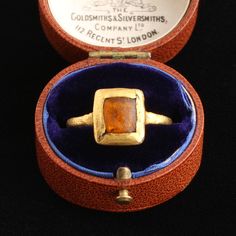 An exquisitely rare Medieval finger ring modeled in high karat gold and set with amber glass. Nineteenth century collectors named this style "tart mold" owing, unsurprisingly, to the setting's resemblance to the shape of a pastry crust. This piece dates to the 12th or 13th century and is Western European in origin. Cc Jewelry, Ancient Rings, Pearl Cluster Ring, Monogram Hearts, Enamel Locket, Diamond Star Necklace, Medieval Rings, Fantasy Ring, Tart Molds