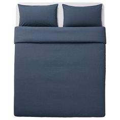 a bed with blue sheets and pillows on it