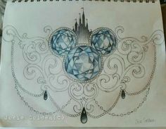 a drawing of mickey mouse's head with blue jewels on it and a castle in the background