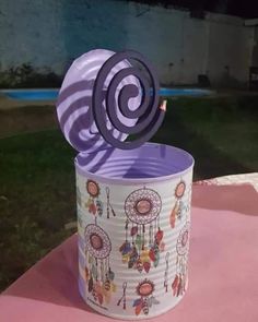 a paper cup that has some kind of decoration on it