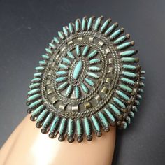 "VINTAGE NAVAJO TURQUOISE NEEDLEPOINT BRACELET DESCRIPTION: Fine slivers of blue turquoise set in heavy gauge vintage sterling silver, this bracelet will be a cherished addition to your collection of fine vintage Native American jewelry. MEASUREMENTS: Interior of the cuff measures 5 1/8\" with an additional 1 1/8\" non-adjustable gap. Total circumference: 6 1/4\" Measures 2 3/8\" straight across the widest part (from wrist bone to wrist bone) Bracelet face measures 3\" wide (the face of the brac Handmade Turquoise Vintage Cuff Bracelet, Vintage Turquoise Round Cuff Bracelet, Vintage Blue Cuff Bracelet, Vintage Turquoise Bracelet, Bone Bracelet, Jewelry Measurements, Bones Bracelet, Vintage Native American Jewelry, Navajo Turquoise