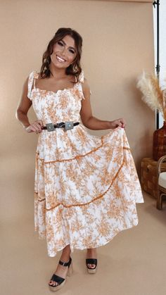 The midi of your boho dreams. Our Wanderlust Lace Trim Floral Midi features a slimming smocked bust, adjustable bow style straps, a tiered design & a dainty floral design throughout. Adjustable bow straps Functional side pockets Lined Smocked bust 100% Cotton; Lining: 100% Polyester Imported Fit: Relaxed; true to size Measurements: S - 29" Bust, 25" Waist, 50" Hips, 42" Length M - 31" Bust, 27" Waist, 52" Hips, 43" Length L - 33" Bust, 29" Waist, 54" Hips, 44" Length Model Specs: Karli + Emily a Bow Straps, Dress Men, Bow Style, Everyday Chic, Everyday Activities, Chic Boutique, Floral Midi Dress, Unisex Design, School Work