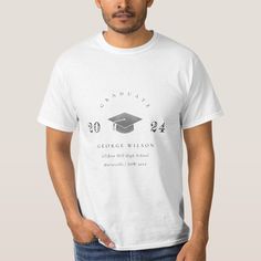 a man wearing a white graduation t - shirt