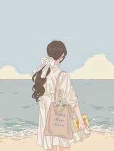 a girl is walking on the beach with a book in her hand and looking at the water