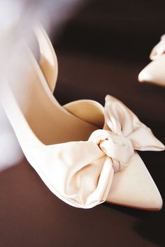 An understated heel with a slingback means you won't be slipping these off when it comes time to dance. Plus that satin bow? Perfect. | Neve Heels by Seychelles in White, Women's, Size: 6, Rubber/Satin at Anthropologie Low Heel Bridal Shoes Lulus, Wedding Shoes Nordstrom, Wedding Shoes Bride Heels Comfy, Satin Ivory Wedding Shoes, Comfy Wedding Shoes Classy, Wedding Shoes Lulus, Wedding Shoes Low Heel Elegant, Bridal Shoes Low Heel Wedding Dress, Bridal Shoes Low Heel Simple