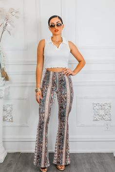 Make a stylish statement with our Paisley Infusion Bell Bottoms. With a playful paisley print, these pants are perfect for adding a touch of personality to any outfit. Buttery soft with great stretch, they're also comfortable and versatile. Perfect for standing out from the crowd in a fun and sexy way. Model is 5’4 wearing 3 1/2 in heals: size small Fit’s true to size One Shoulder Tops, Cutie Pie, Cropped Top, Black Maxi Dress, Fashion Tops, Paisley Print, Bell Bottoms, Casual Tops, Unique Style