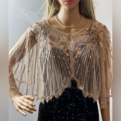 Sequin Embellished Fringed Cape Be A Glamorous Queen Dress To Pair With Your Dress Or Jeans. Sequin Designed Size One Size Fits Most Bust Size 29’ Height 13’ Shoulder Length Length ¾ Shoulder Fabric Polyester Hand Wash Elegant Long Sleeve Embellished Tops, Elegant Embellished Tops For Festive Season, Elegant Long Sleeve Sparkling Tops, Elegant Sparkling Long Sleeve Tops, Elegant Beaded Tops For Party Season, Elegant Beaded Evening Top, Elegant Beaded Tops For Evening, Elegant Beaded Tops For Wedding, Elegant Evening Tops With Rhinestones