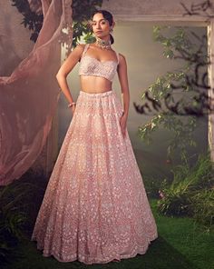 Featuring an orchid pink organza lehenga with white thread work. It is embellished with sequence and bugle beads.From Aneesh Agarwaal's Ellora collection.DELIVERY TIMEPlease allow 8-12 weeks for your outfit to arrive.FABRIC DETAILSOrganzaProfessional cleaning only. Pink Organza Lehenga, Tulle Lehenga, Pastel Lehenga, Organza Lehenga, Traditional Indian Dress, Padded Blouse, Pink Lehenga, Beaded Neckline, Indian Wedding Outfits