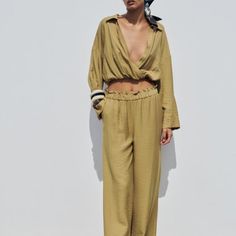 Long Sleeve Top With Wrap V-Neckline And Lapel Collar. Elastic Hem. Outer Shell 87% Viscose 13% Polyamide 10 Khaki | 3564/097 Pants With A High Gathered Elastic Waist. Front Pockets. Wide Leg. Outer Shell 87% Viscose 10 13% Polyamide Khaki | 3564/093 Beige Linen Pants, High Waisted Trouser Pants, Zara Shirt Dress, Zara Scarf, Zebra Print Skirt, Printed Flare Pants, Tie Waist Pants, Crop Top Set, Wide Leg Palazzo Pants