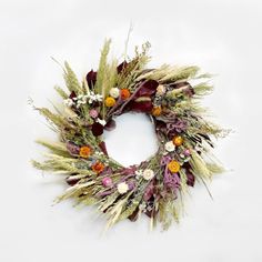 The Burgundy Statice Wreath. Made with: preserved burgundy salal, avena oats, blonde wheat, sweet annie, prosso millet, heirloom millet, rattail statice, eryngium, pearly everlasting, and strawflowers. (zoomed out image) Pearly Everlasting, Spring Flower Wreath, Dried Wreath, Wreath Indoor, Indoor Wreath, Natural Flowers, Rose Wreath, Fall Holidays, Pine Cone