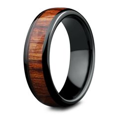 a black ceramic ring with wood inlay