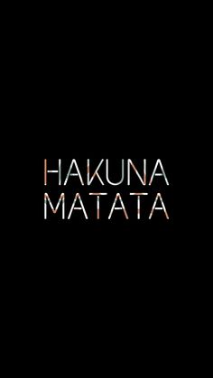 the words hakuna matata written in black and white on a dark background