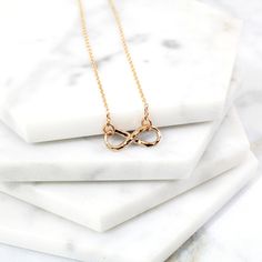 "Beautiful and lovely tiny infinity pendent necklace. Made of hammered rose gold plated infinity pendent with skinny rose gold plated chain. Soft and warm. Great for gift , everyday or special occasion. Your item will ship in a gift box. Please feel free to contact me if you have any question. ♥ Length available 14\" -20\" ♥ Pendent 5/8\" x 1/4\" ♥Rose gold plated over brass ♥ Delivery Time Fast shipping within 1 - 3 days ♥ See more Rudiana Accessories Rudiana.etsy.com" Dainty Infinity Rose Gold Necklace, Dainty Rose Gold Infinity Necklace, Dainty Rose Gold Infinity Jewelry, Dainty Infinity Necklace As Gift For Her, Necklace Infinity, Necklace Rose Gold, Infinity Necklace, Pendent Necklace, Necklace Rose