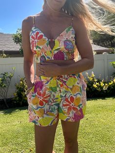 These Calabash printed shorts feature a playful print, matching tops, and convenient side pockets. The partially lined top adds a fun touch to this unique piece. Perfect for those with a height of 5'7'' and measurements of 32'' bust, 24'' waist, and 35'' hips. Printed Shorts, Unique Pieces