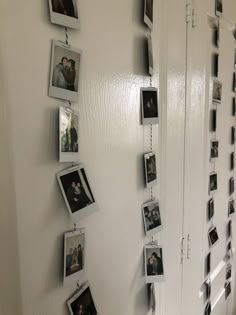 a wall with pictures hanging on it's sides and photos attached to the walls