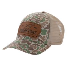 the field stone camo trucker hat has a brown leather patch on the front