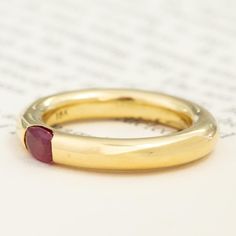 We recently acquired a stack of hefty, gold tubular bands with flush-set gemstones that we’re totally obsessed with! This one centers on a bright raspberry-red ruby, which looks like perfection in yellow gold. Each of these bands feels buttery on the hands, with a delicious weight to boot. A beautiful stacker, but just as gorgeous when worn solo. 18kt yellow gold Size 6.25 and slightly resizable with limitations. Ruby measures 5.4 x 3.84 x 2.83mm, VS2/SI1 type II clarity. GIA standards. Please s Luxury Stackable Ruby Ring, Yellow Gold Ruby Ring With Polished Round Cut, Yellow Gold Stackable Ruby Ring, Yellow Gold Stackable Ruby Rings In Round Cut, Yellow Gold Stackable Ruby Rings Round Cut, Yellow Gold Ruby Ring With Polished Finish, Yellow Gold Ruby Birthstone Ring With Round Band, Yellow Gold Ruby Birthstone Ring, Gold Stackable Ruby Ring