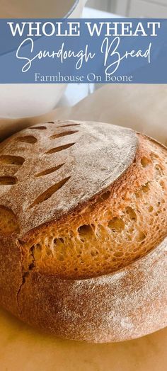 a loaf of whole wheat sourdough bread sitting on top of a counter