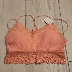 Coral Colored M/L Bralette Spring Cami Bra With Lace Trim, Spring Lace Cami Bra, Spring Underwire Tops With Straps, Spring Camisole With Underwire And Straps, Spring Camisole With Straps And Underwire, Seamless Lace Bra For Spring, Spring Stretch Cami Bra, Spring Camisole Bra With Delicate Lace, Spring Camisole Bra With Delicate Straps