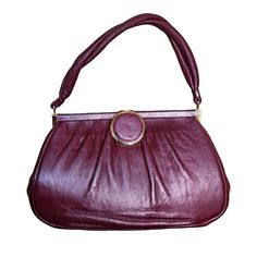 "This gorgeous Vintage 60s-70s Maroon Burgundy Leather Gold Top Handle Handbag Purse. reminds you of one of your grandmother's bags, but in an updated way.  Pair this with jeans, dress, suit the ideas are endless with this one.  It comes with a snap closure, gold tone trim, inside zipper and lined in black. 10\" L 6.5\" W 6\" Inside Depth 5.75\" Strap Drop" Retro Burgundy Shoulder Bag, Retro Burgundy Bags For Daily Use, Retro Burgundy Shoulder Bag For Daily Use, Retro Burgundy Rectangular Bag, Retro Burgundy Travel Bag, Retro Burgundy Satchel Shoulder Bag, Retro Leather Shoulder Bag For Party, Retro Burgundy Bag For Everyday Use, Retro Burgundy Formal Bag