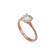 a rose gold engagement ring with an oval cut diamond in the center, on a white background