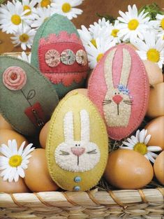 an easter basket filled with painted eggs and flowers