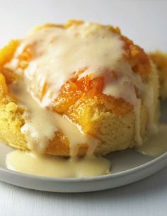 a close up of a pastry on a plate with sauce drizzled over it