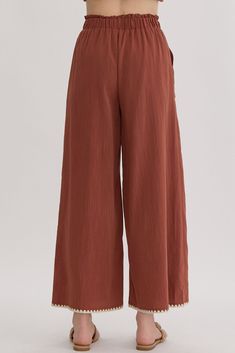 High waisted wide leg pants featuring trim detail. Elastic waistband, pocket at sides. Lined, woven, non-sheer, lightweight.49% rayon, 34% polyester, 17% nylon. True to size, I am an 8/10 wearing a medium. Small 4-6Medium 8-10Large 12-14 Solid Color Wide Leg Parachute Pants For Work, Solid Wide Leg Parachute Pants For Work, Brown Wide Leg Bottoms For Spring, Chic Wide-leg Parachute Pants With Elastic Waistband, Brown Full Length Wide Leg Pants With Elastic Waistband, Brown Relaxed Fit Wide Leg Parachute Pants, Summer Wide Leg Solid Parachute Pants, Brown Wide-leg Bottoms With Loose Fit, Brown Wide Leg Bottoms With Loosely Fitted Hips