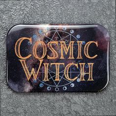 a metal sign that says cosmic witch on it